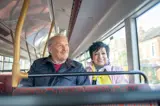A Couple Sat Together On The Bus, Smiling