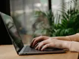 Someone typing on a laptop keyboard